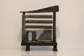 An Abstract steel sculpture of with angular and linear shapes