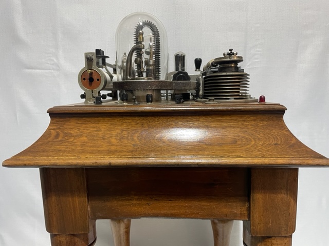 A large sculpture made using a table and various mechanical components