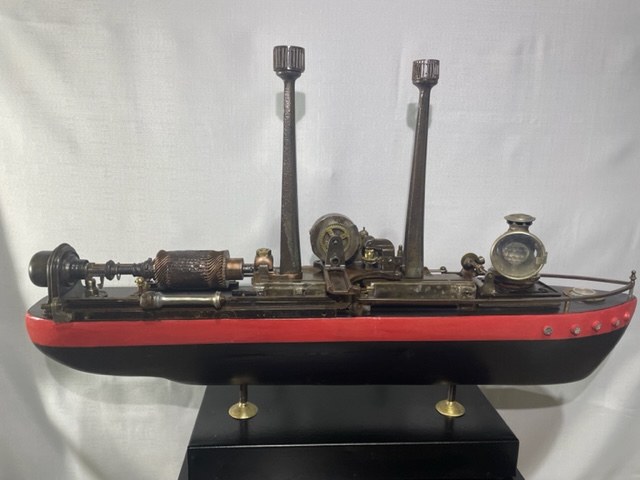 A sculpture of a ship made from timber, gramophone parts and office equipment